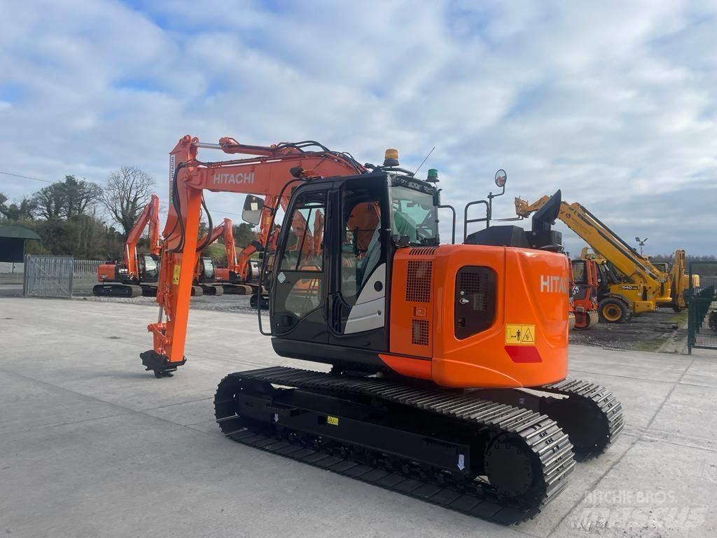 Hitachi ZX 135 US-6 حفارات زحافة