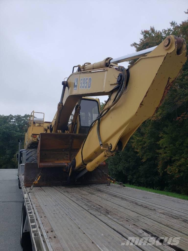 John Deere 595D حفارات بعجل