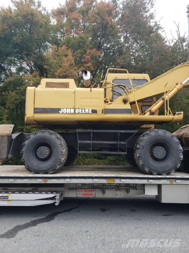 John Deere 595D حفارات بعجل