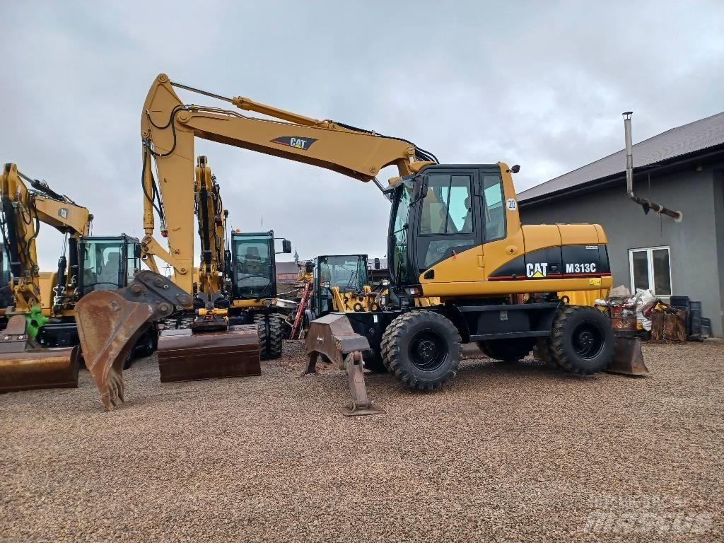CAT M 313 C حفارات بعجل