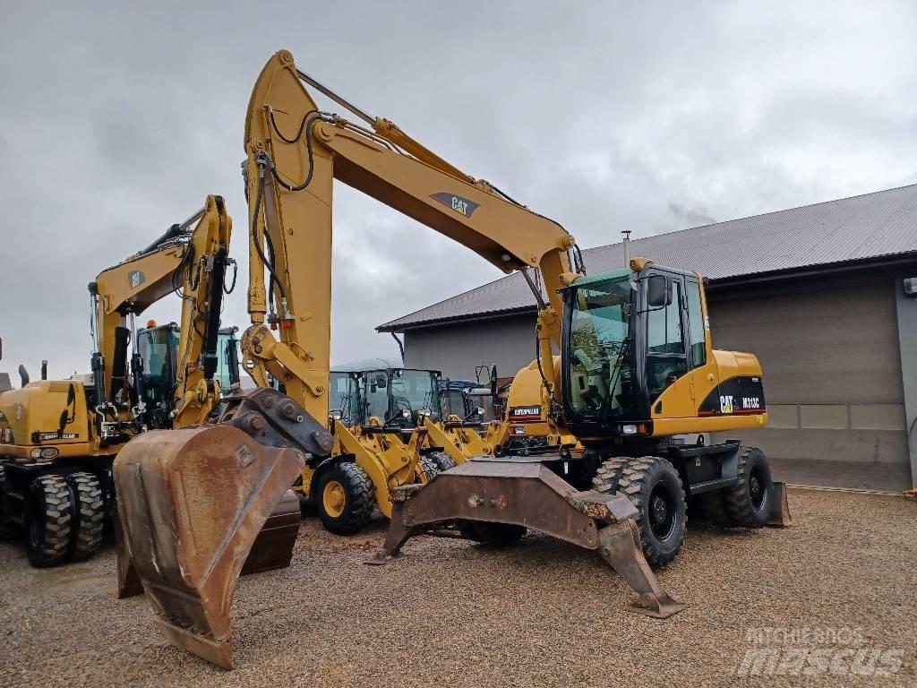 CAT M 313 C حفارات بعجل