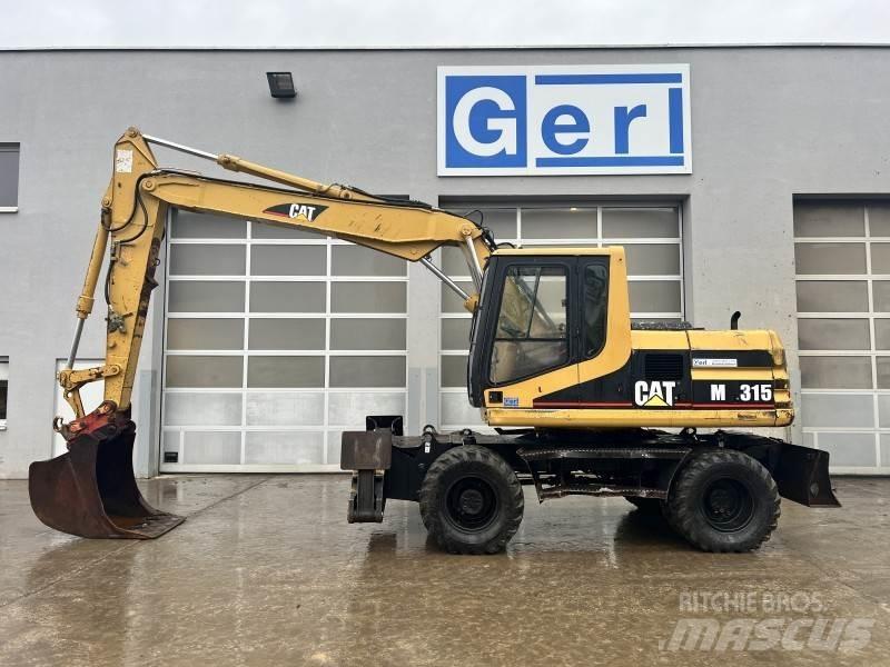 CAT M 315 حفارات بعجل