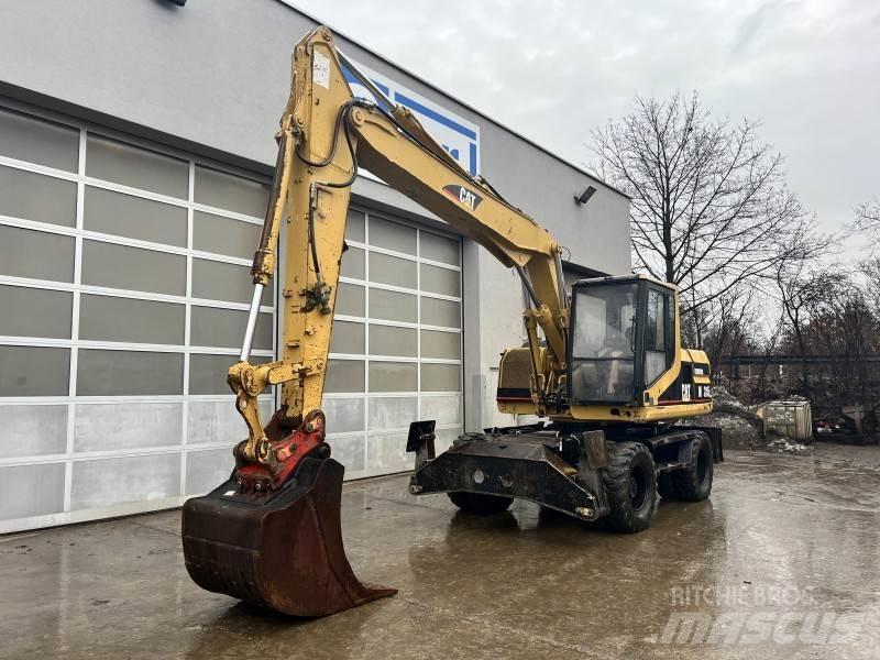 CAT M 315 حفارات بعجل