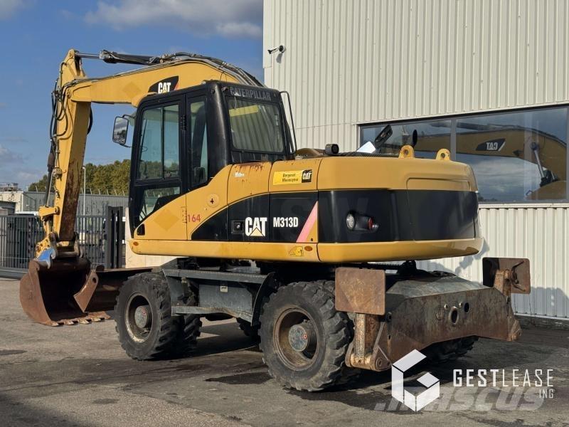 CAT M313D حفارات بعجل