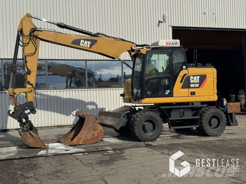 CAT M315F حفارات بعجل