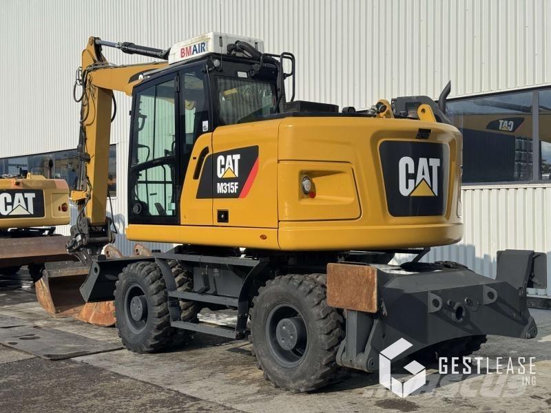 CAT M315F حفارات بعجل
