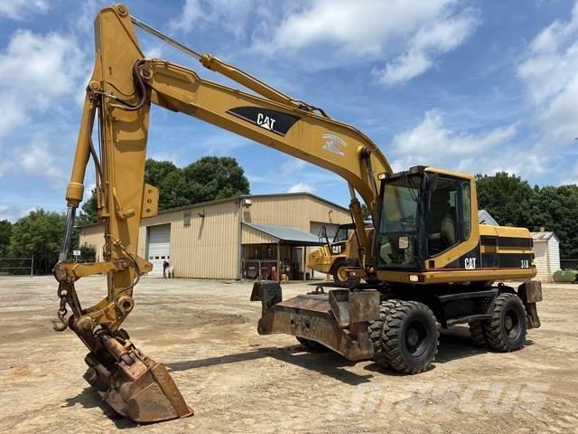 CAT M318 حفارات بعجل