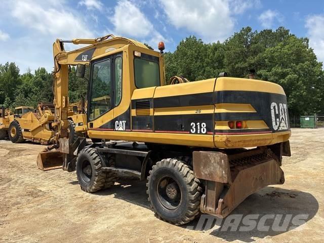 CAT M318 حفارات بعجل