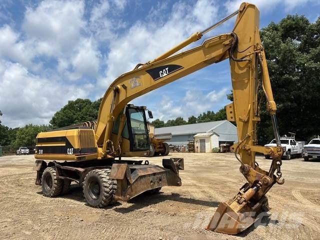 CAT M318 حفارات بعجل