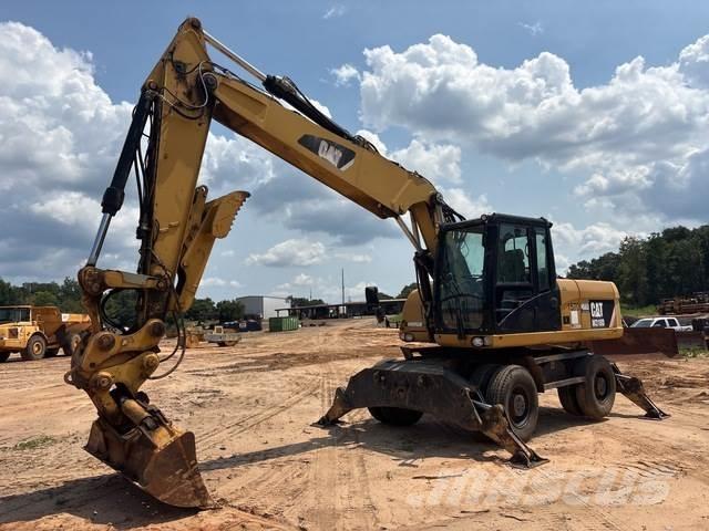 CAT M318D حفارات بعجل