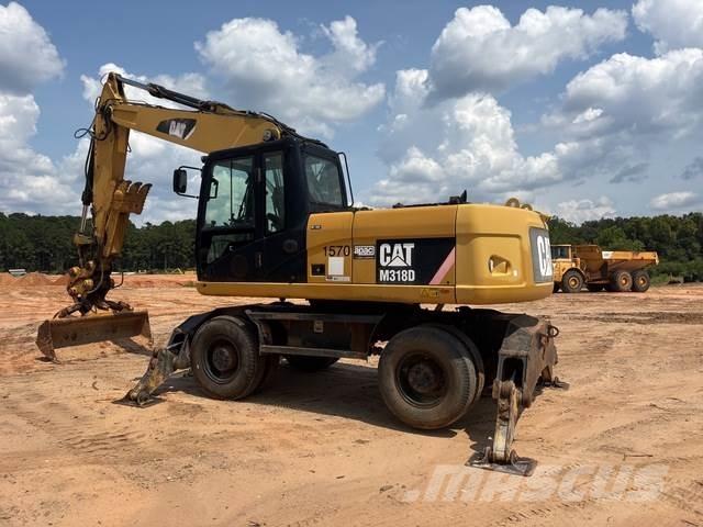 CAT M318D حفارات بعجل