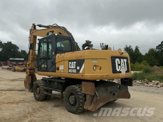 CAT M318D حفارات بعجل