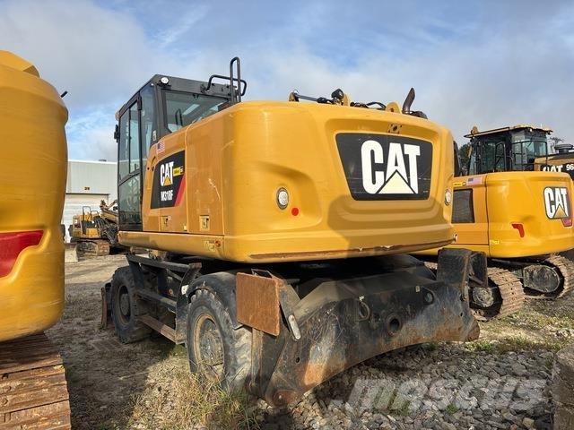 CAT M318F حفارات بعجل