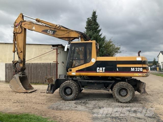CAT M320 حفارات بعجل