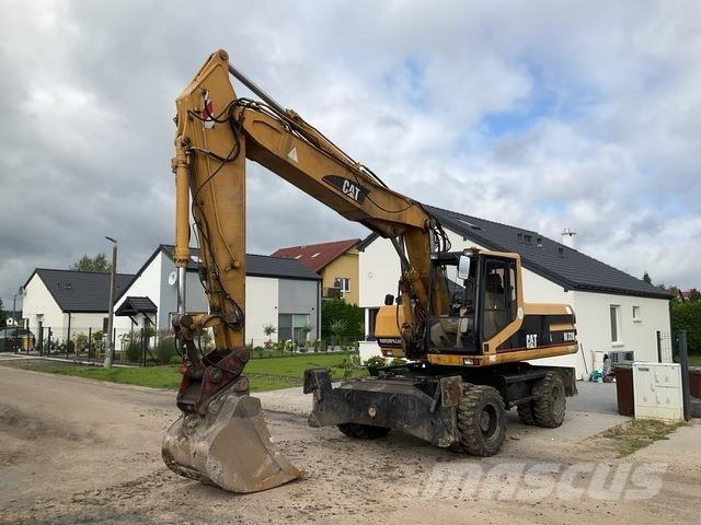 CAT M320 حفارات بعجل