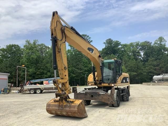 CAT M322D حفارات بعجل