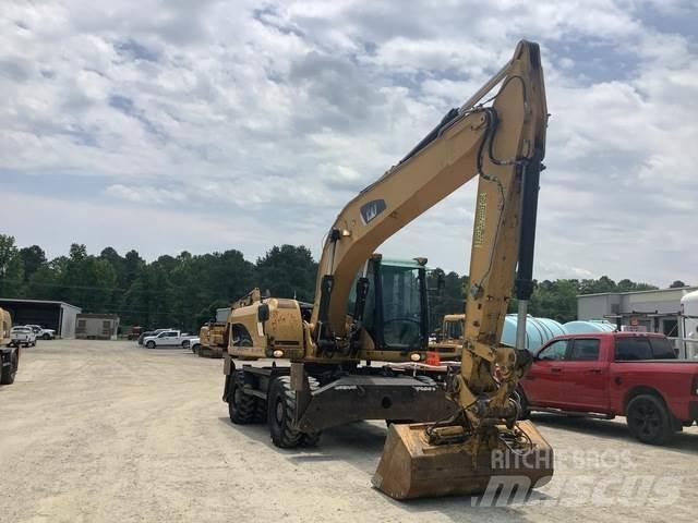 CAT M322D حفارات بعجل