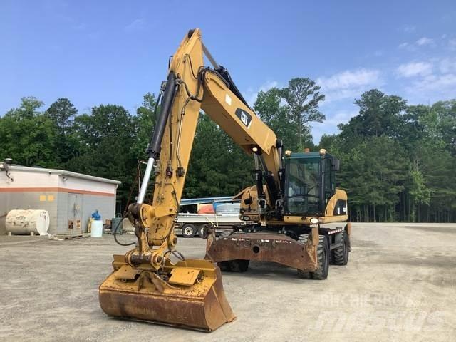 CAT M322D حفارات بعجل