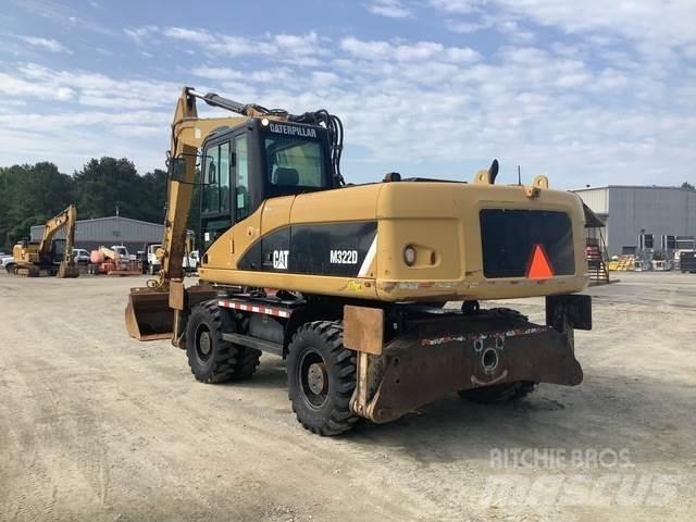 CAT M322D حفارات بعجل
