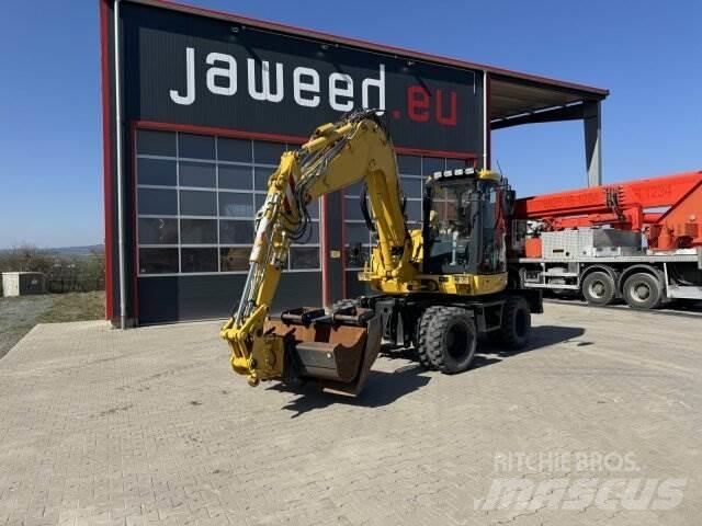 Komatsu PW98 MR10 حفارات بعجل