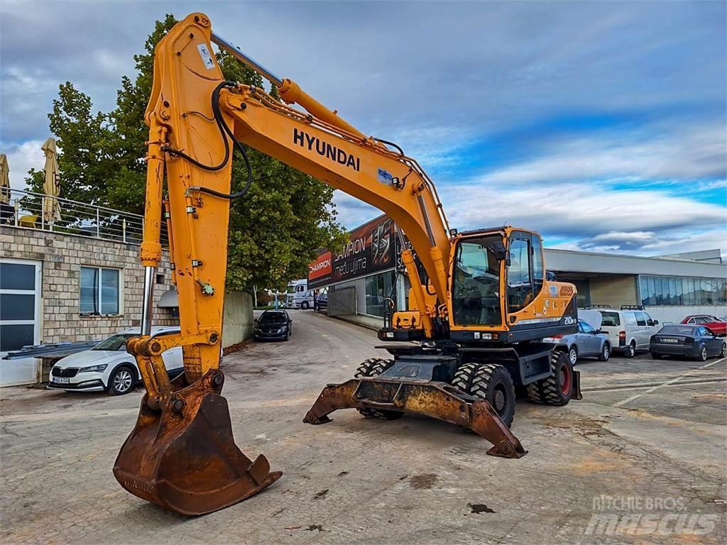 Hyundai R210W-9 حفارات بعجل