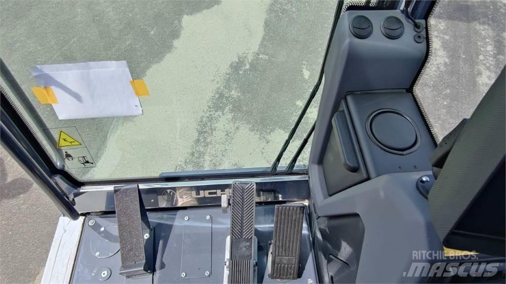Fuchs MHL 320 حفارات بعجل