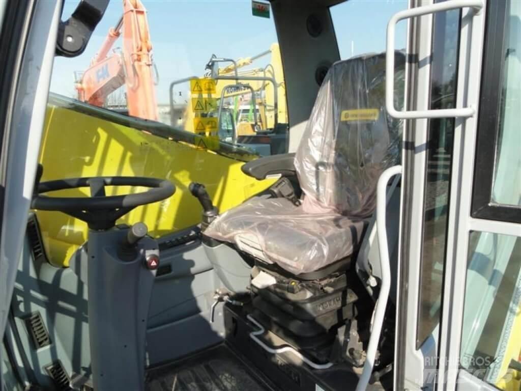 New Holland WE210 حفارات بعجل