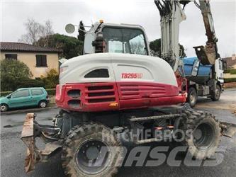 Takeuchi TB295W حفارات بعجل