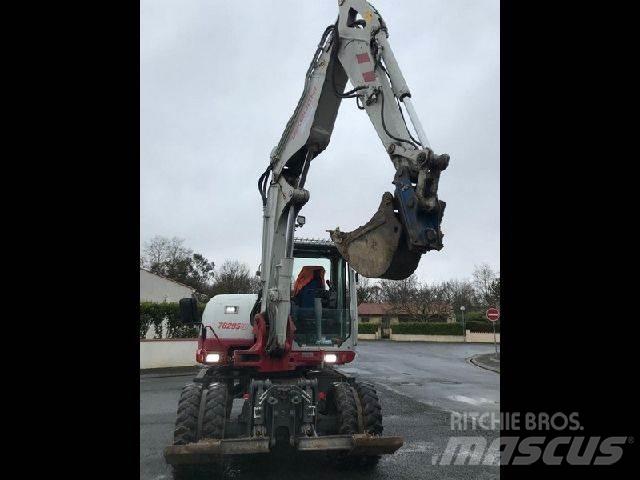 Takeuchi TB295W حفارات بعجل