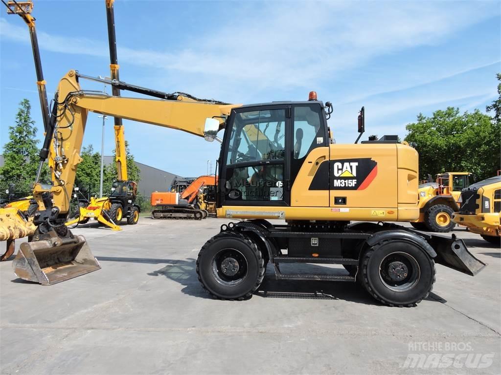 CAT M315 حفارات بعجل