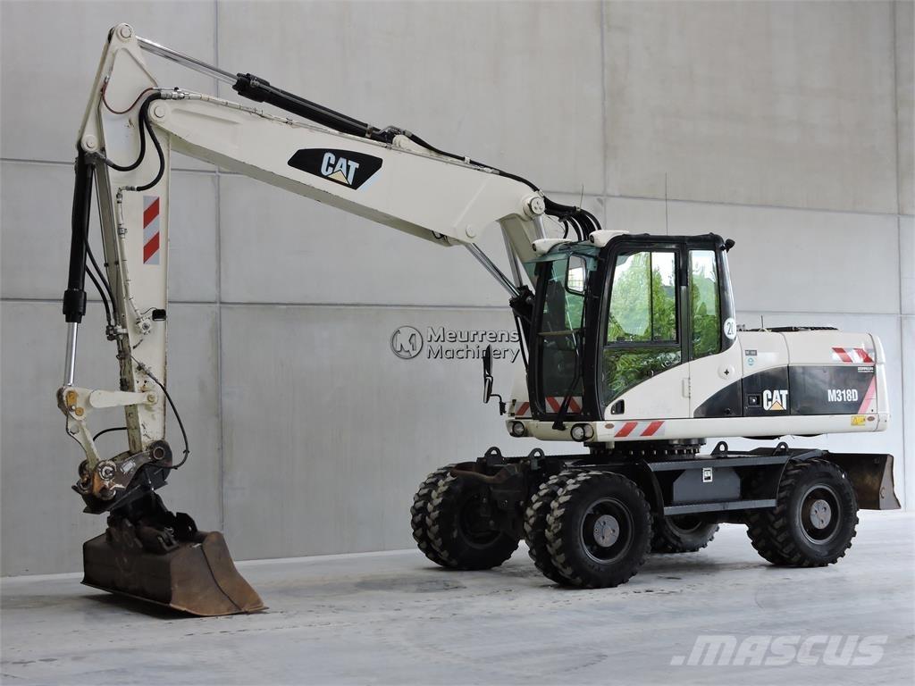 CAT M318D حفارات بعجل