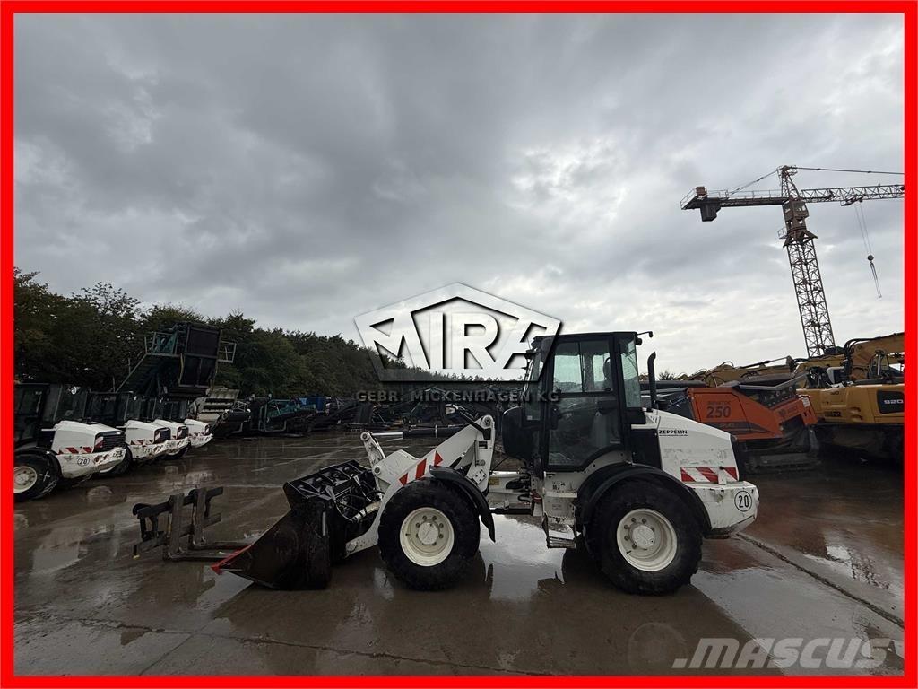 CAT 908M لوادر بعجل