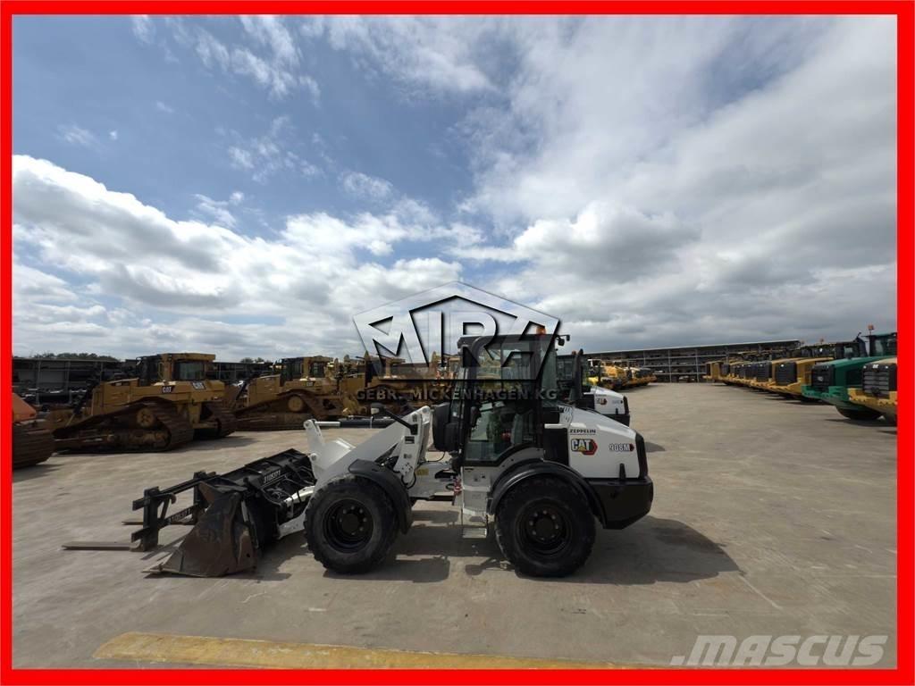 CAT 908M لوادر بعجل