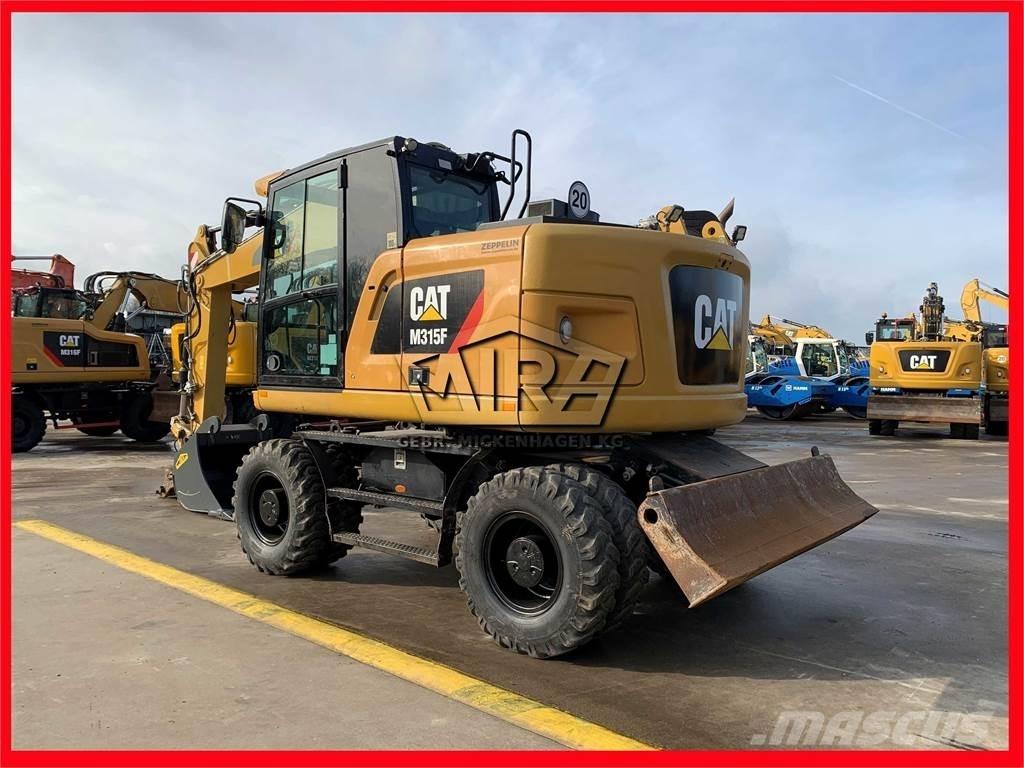CAT M 315 F حفارات بعجل
