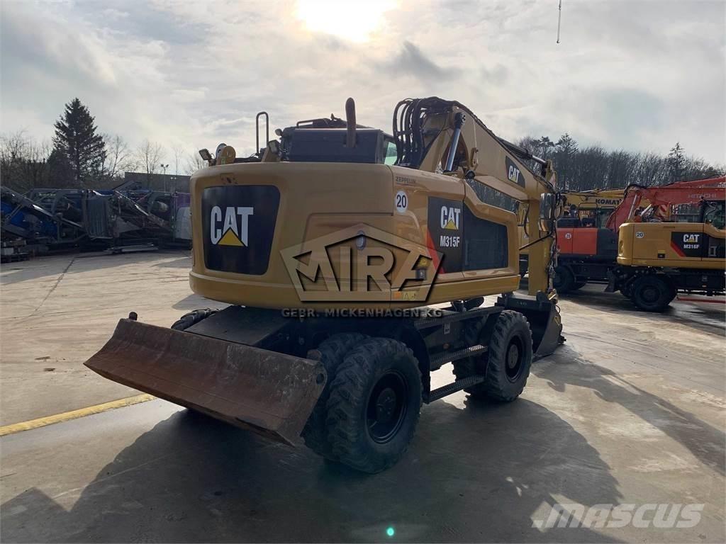 CAT M 315 F حفارات بعجل