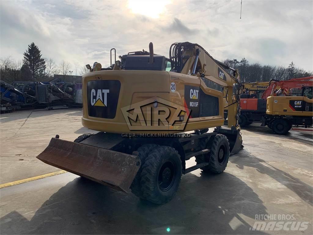 CAT M315 F حفارات بعجل
