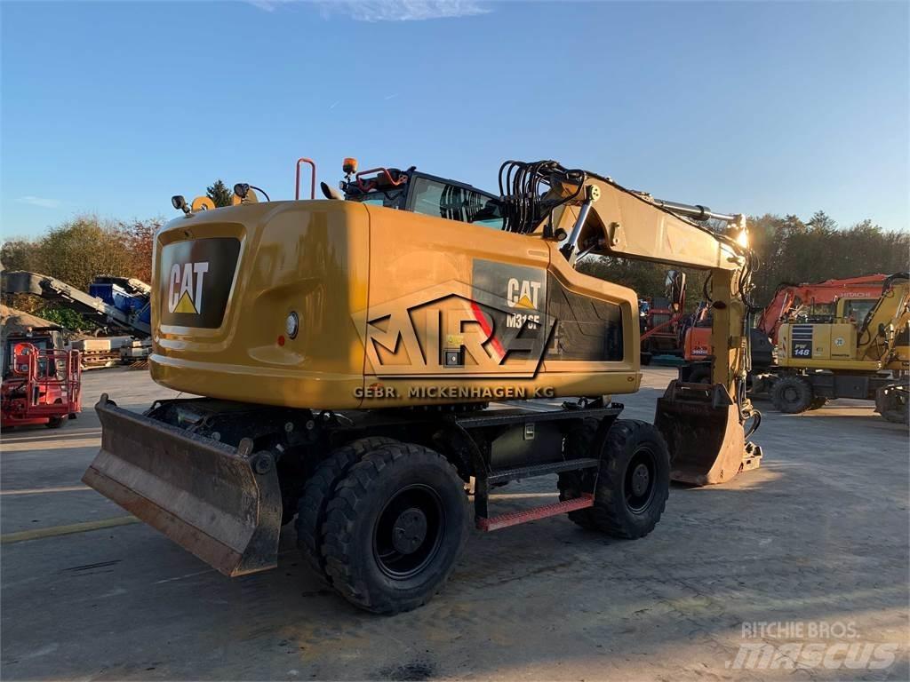 CAT M316 F حفارات بعجل