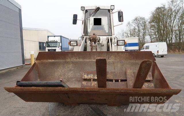 CAT 910 E لوادر بعجل
