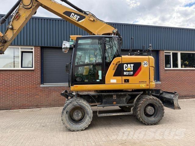 CAT M317 F حفارات بعجل