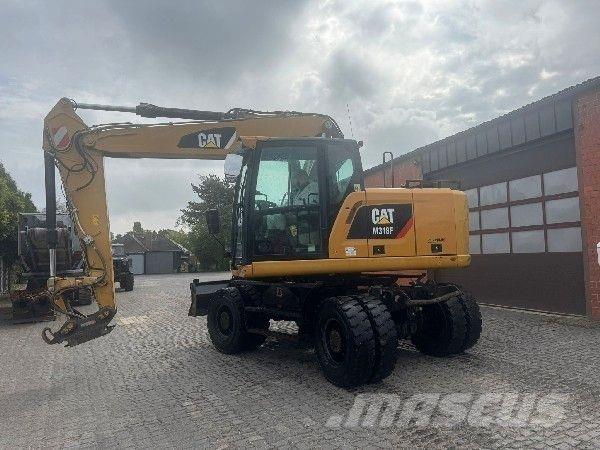 CAT M318F حفارات بعجل