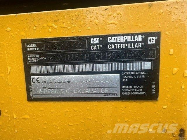 CAT M318F حفارات بعجل
