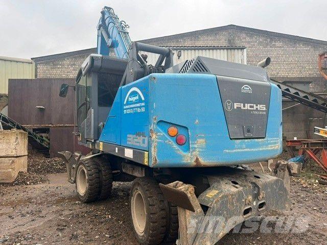 Fuchs MHL320 T4f حفارات بعجل
