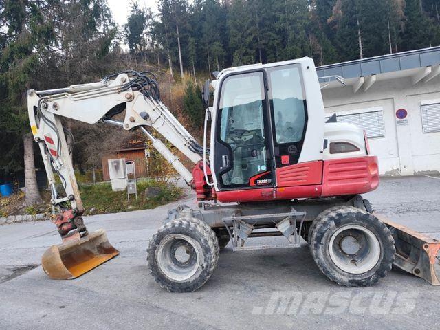 Takeuchi TB295W حفارات بعجل