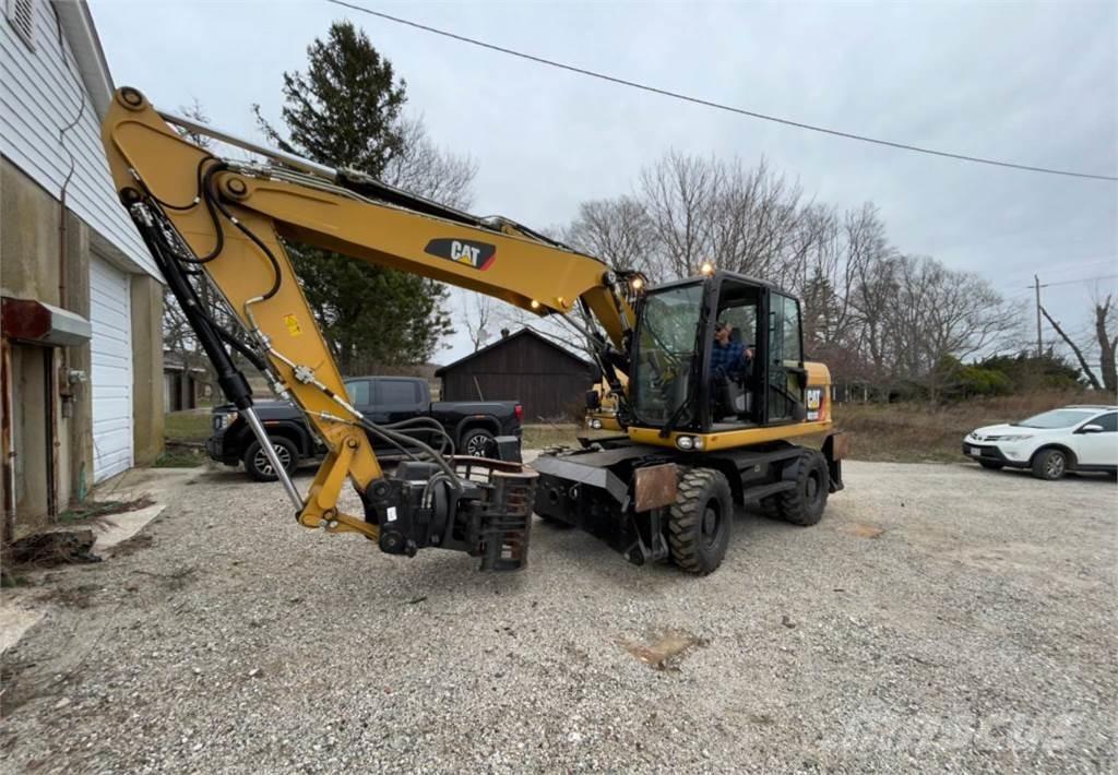 CAT M313D حفارات بعجل