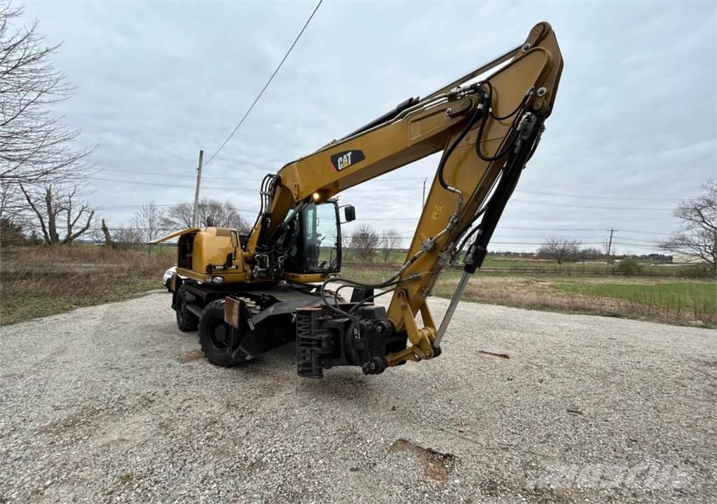 CAT M313D حفارات بعجل