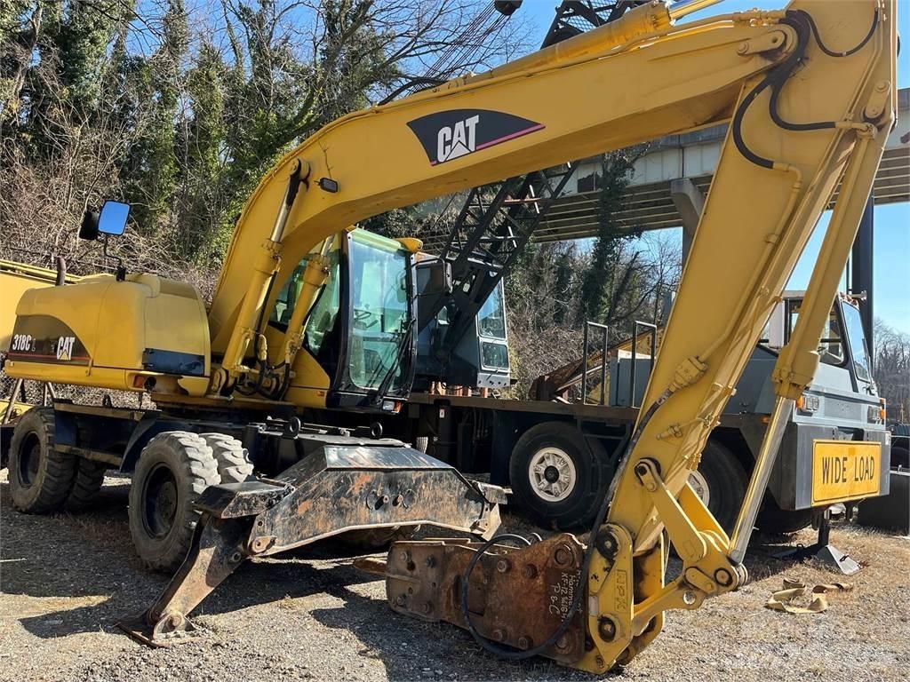 CAT M318C حفارات بعجل