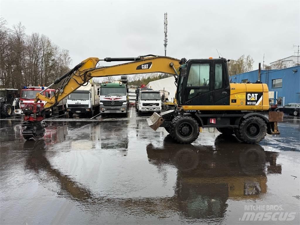 CAT M313 D حفارات بعجل