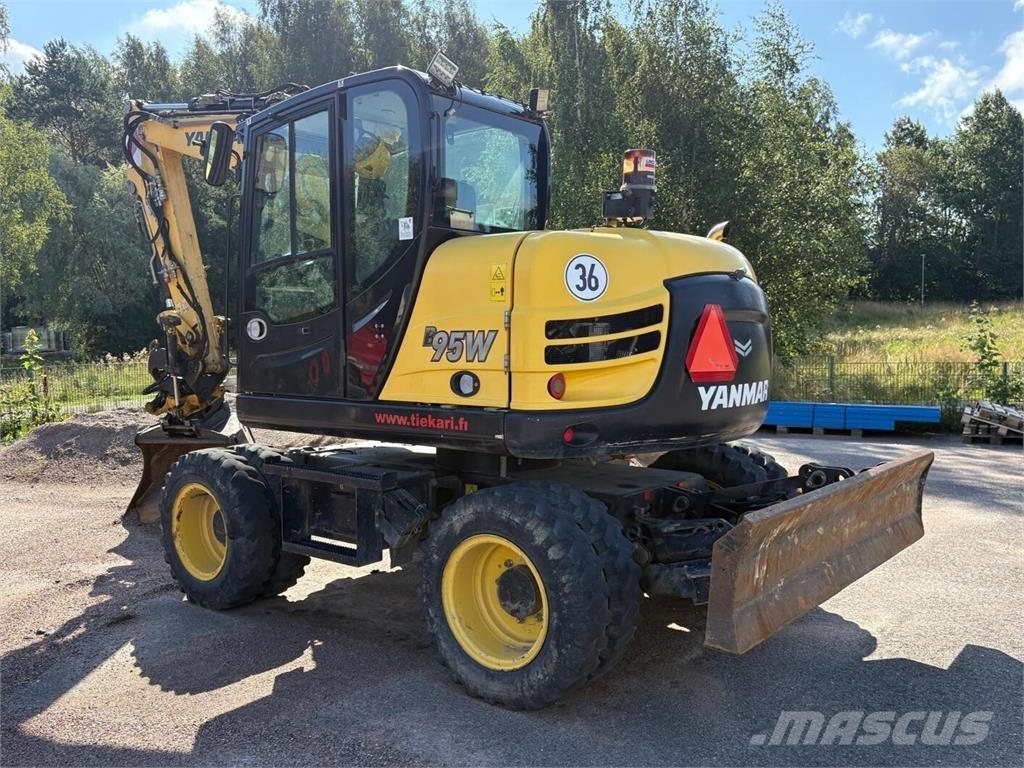 Yanmar B 95 W حفارات بعجل