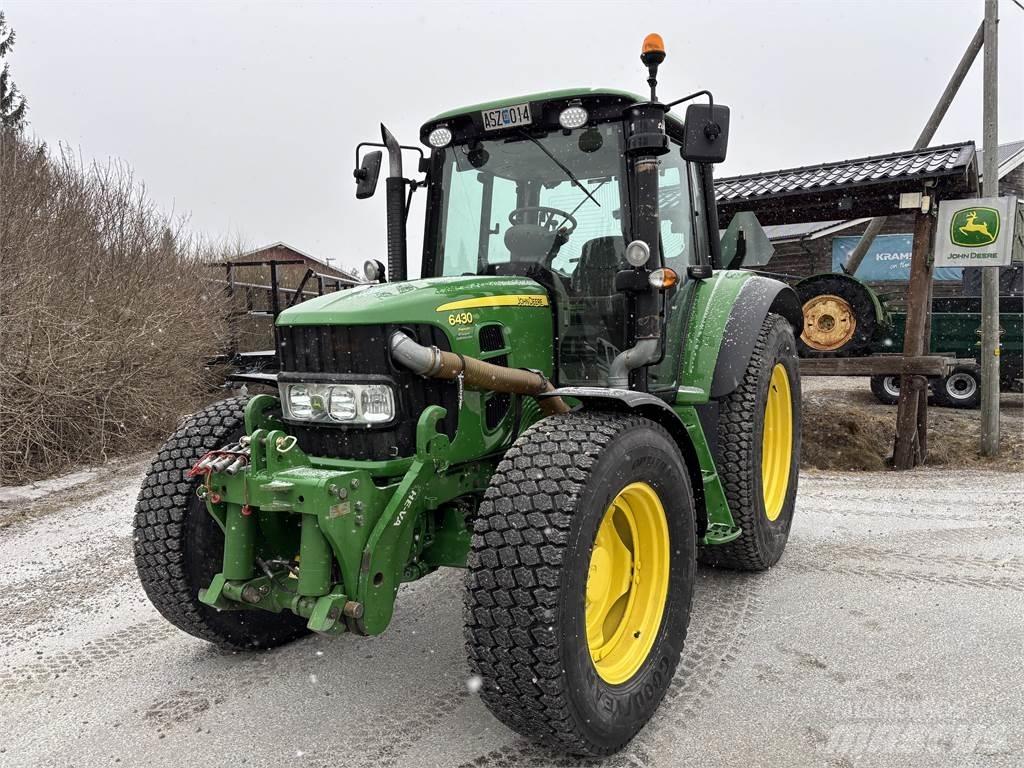 John Deere 6430 الجرارات