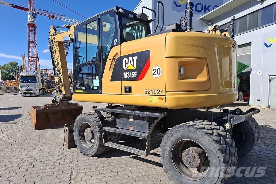 CAT M 315 F حفارات بعجل